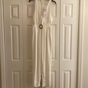 White jumpsuit, never worn, just doesn’t  fit now.